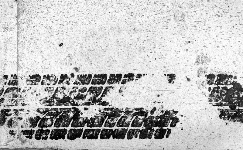 image before we remove tire skid marks from concrete