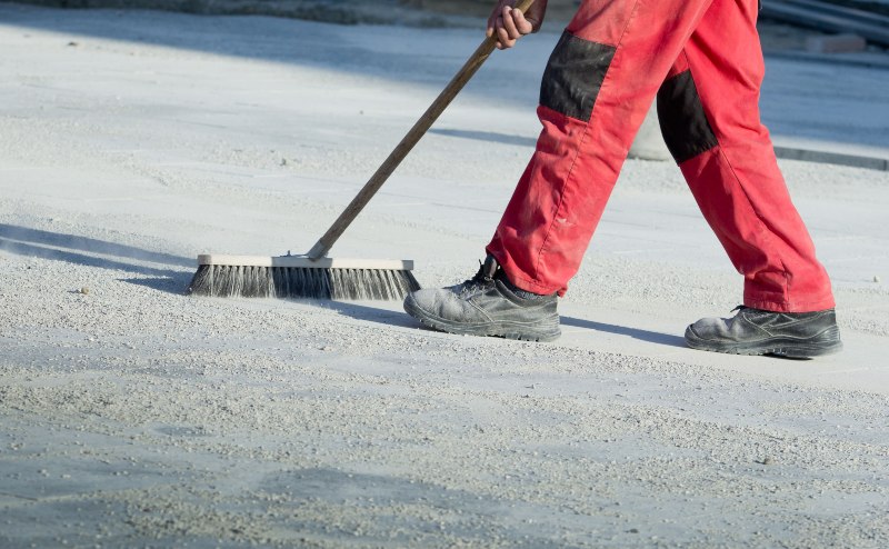 remove oil absorbent from concrete floor